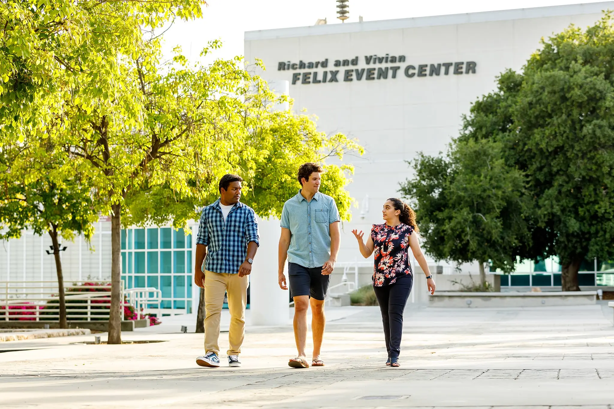Three students strollling on West Campus