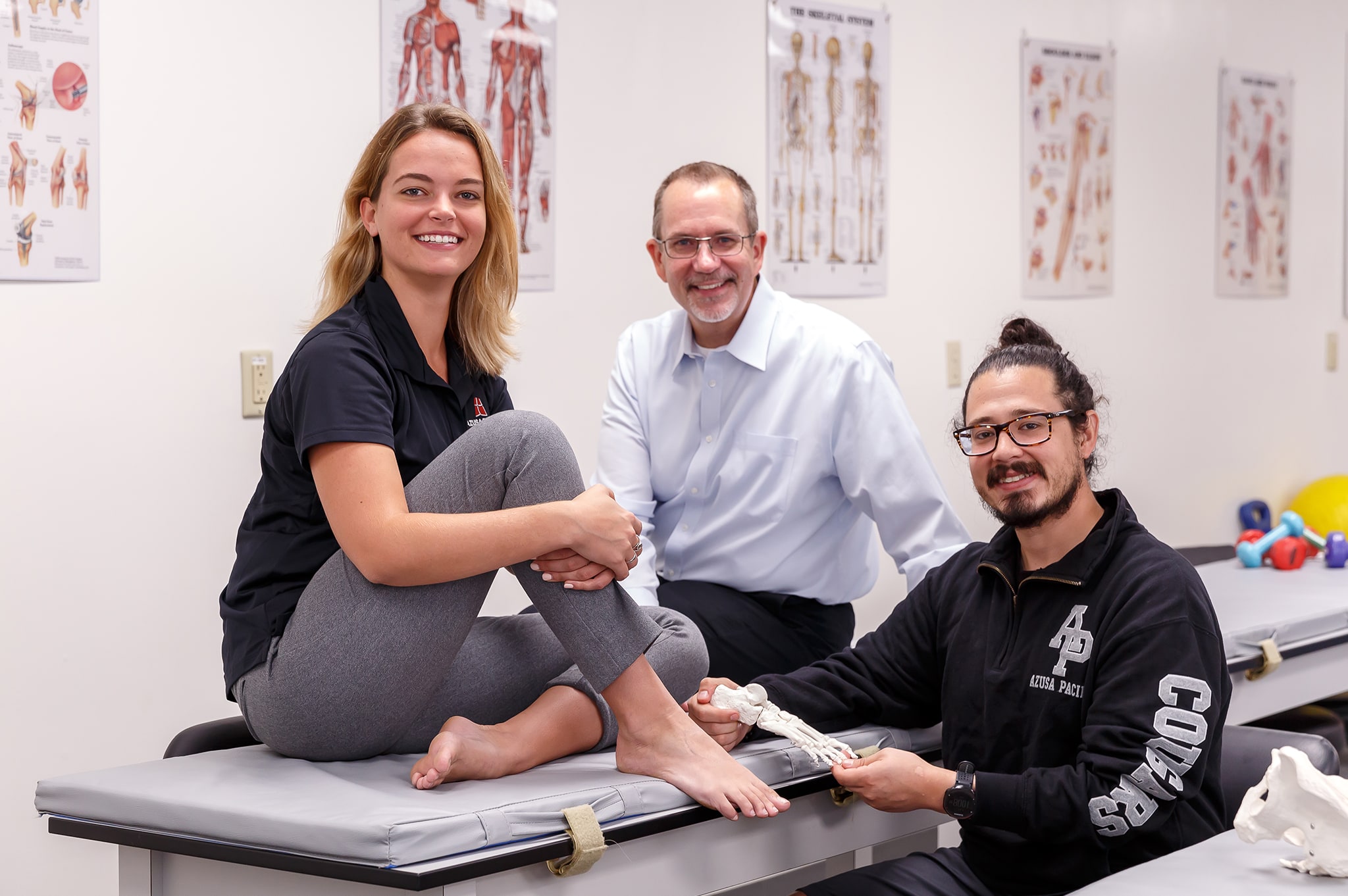 students and professor smiling