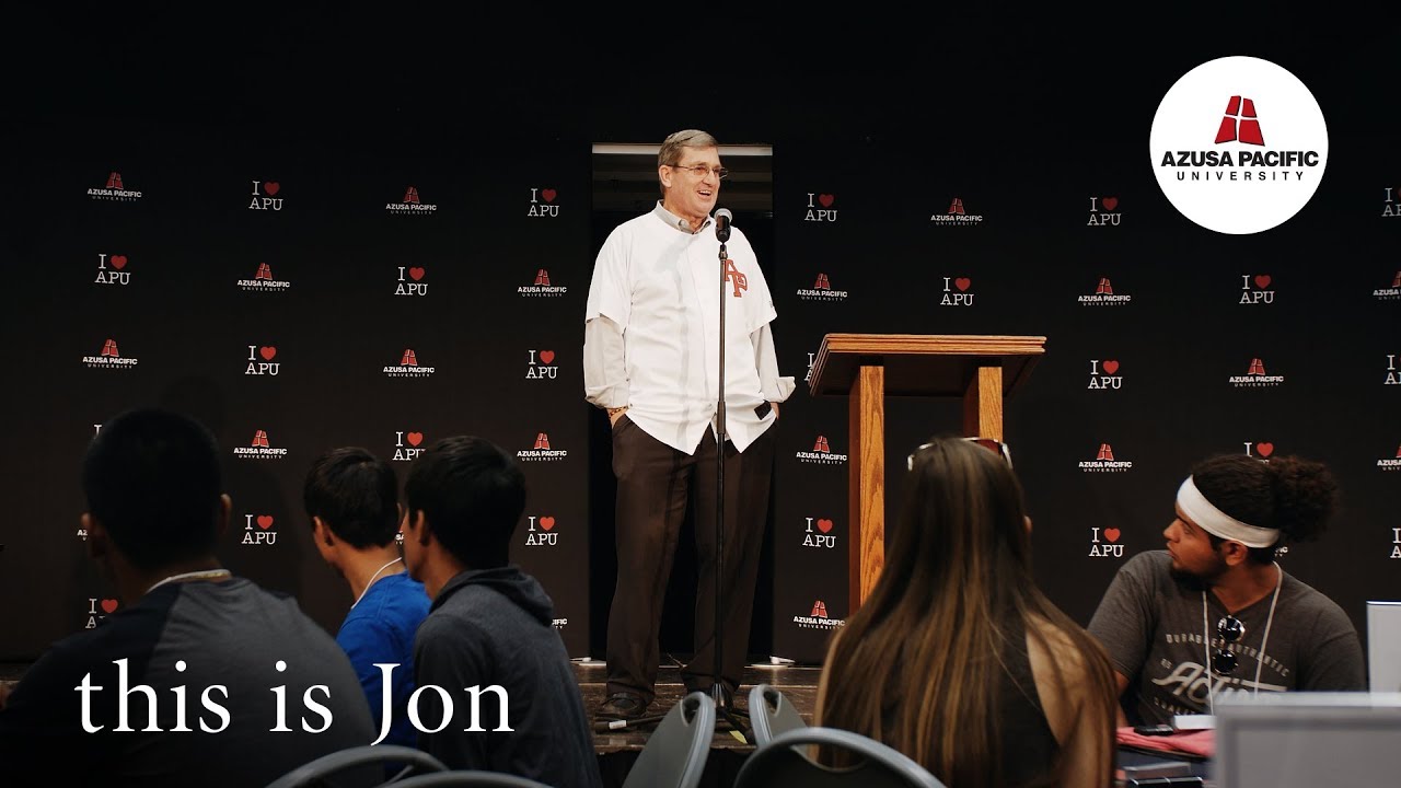 Jon behind a podium