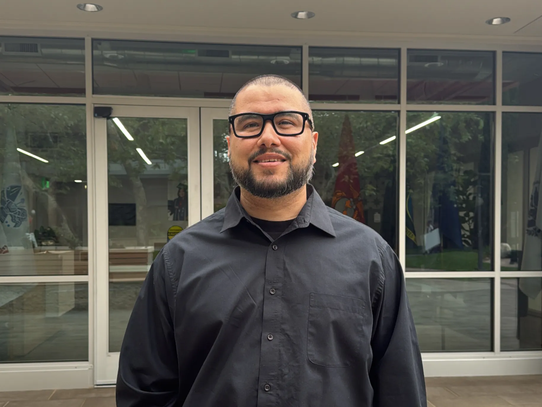 Dustin Coello ’26 stands in front of new Military and Veteran Center.