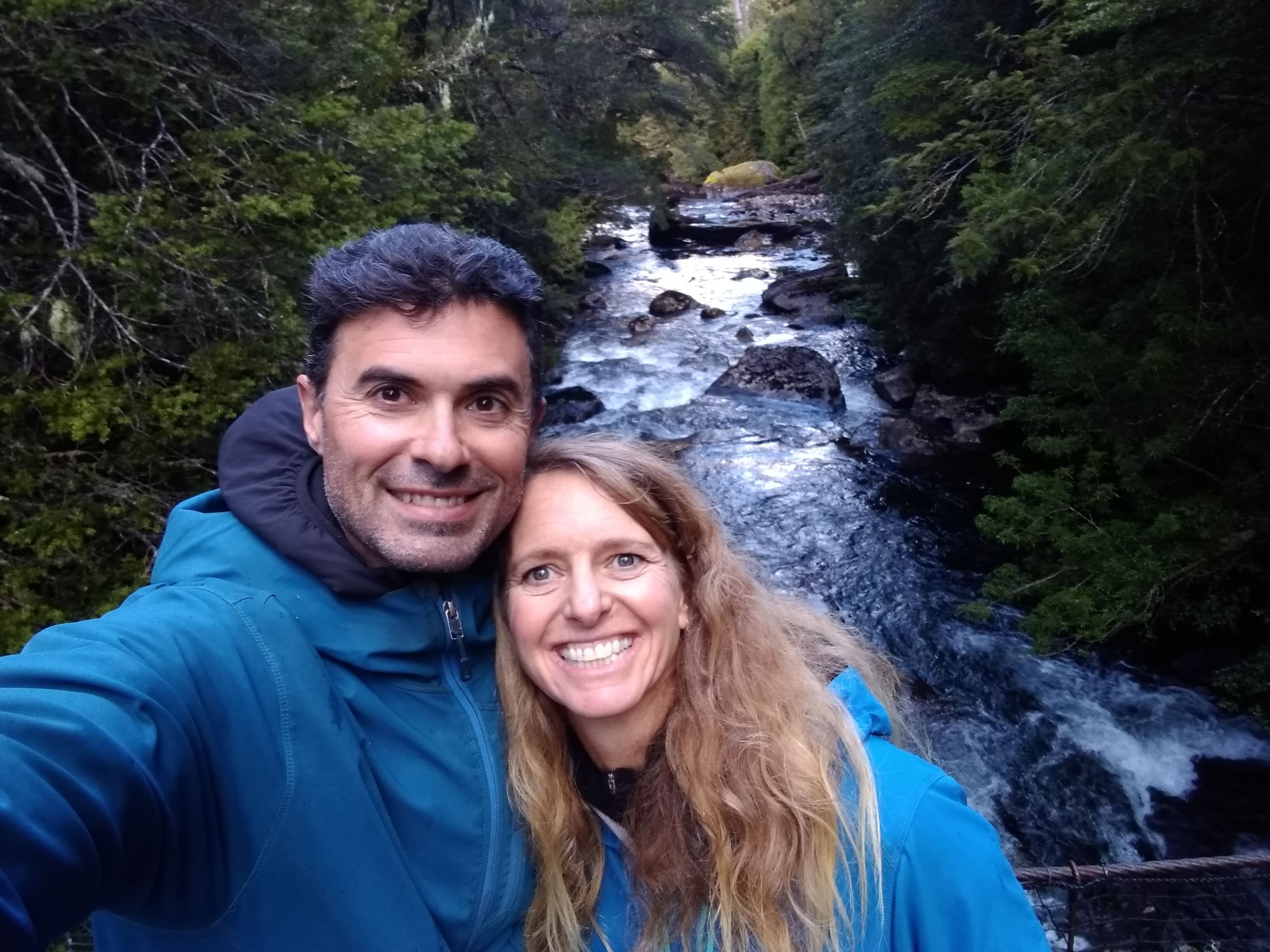 A selfie of Dylan and Cheri Harris in front of a river
