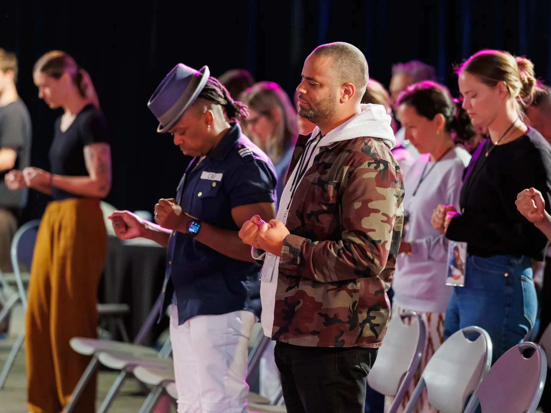 A group of people worship together.