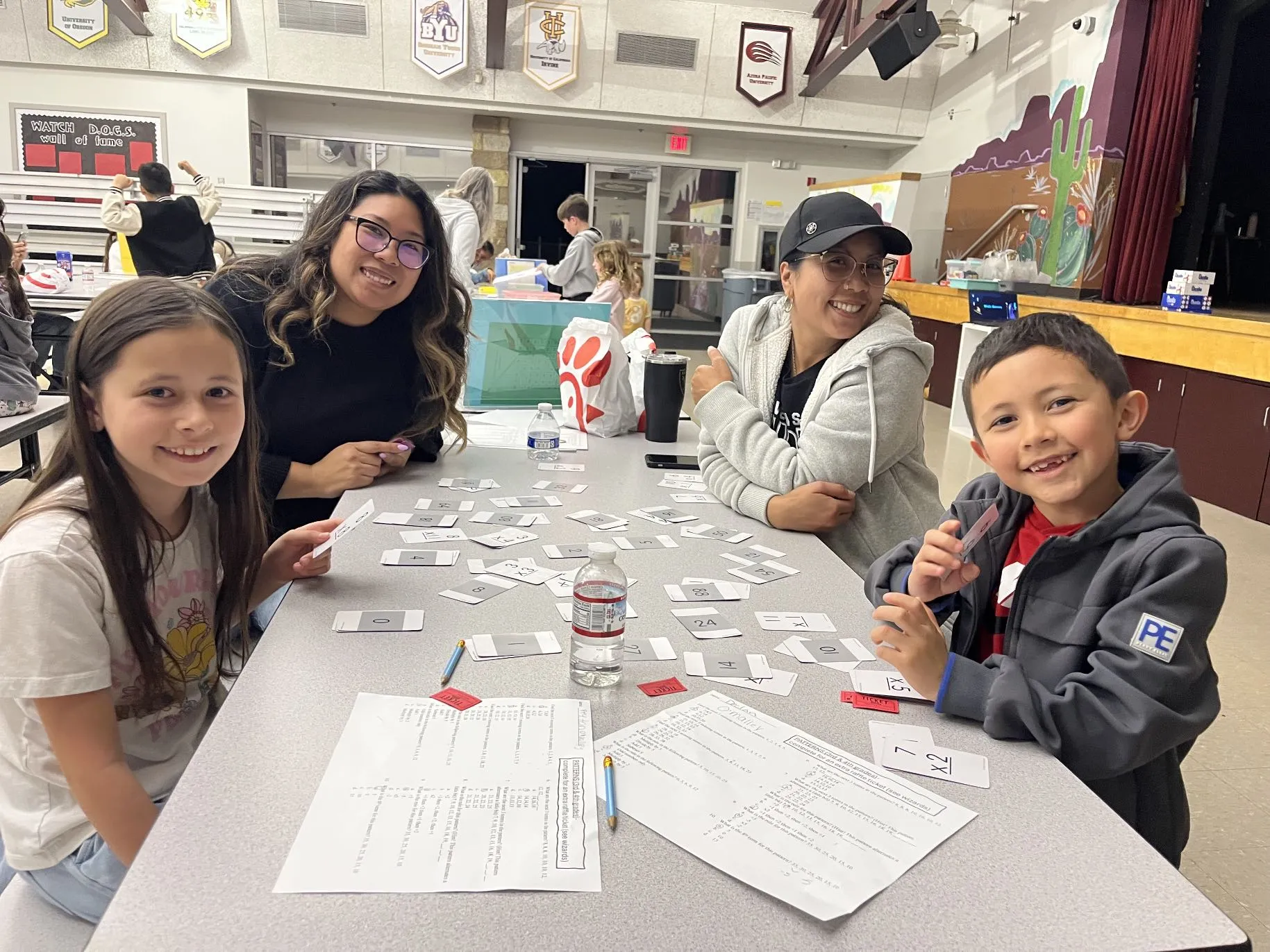 Students and their families playing math games at the Magic of Math Night event.