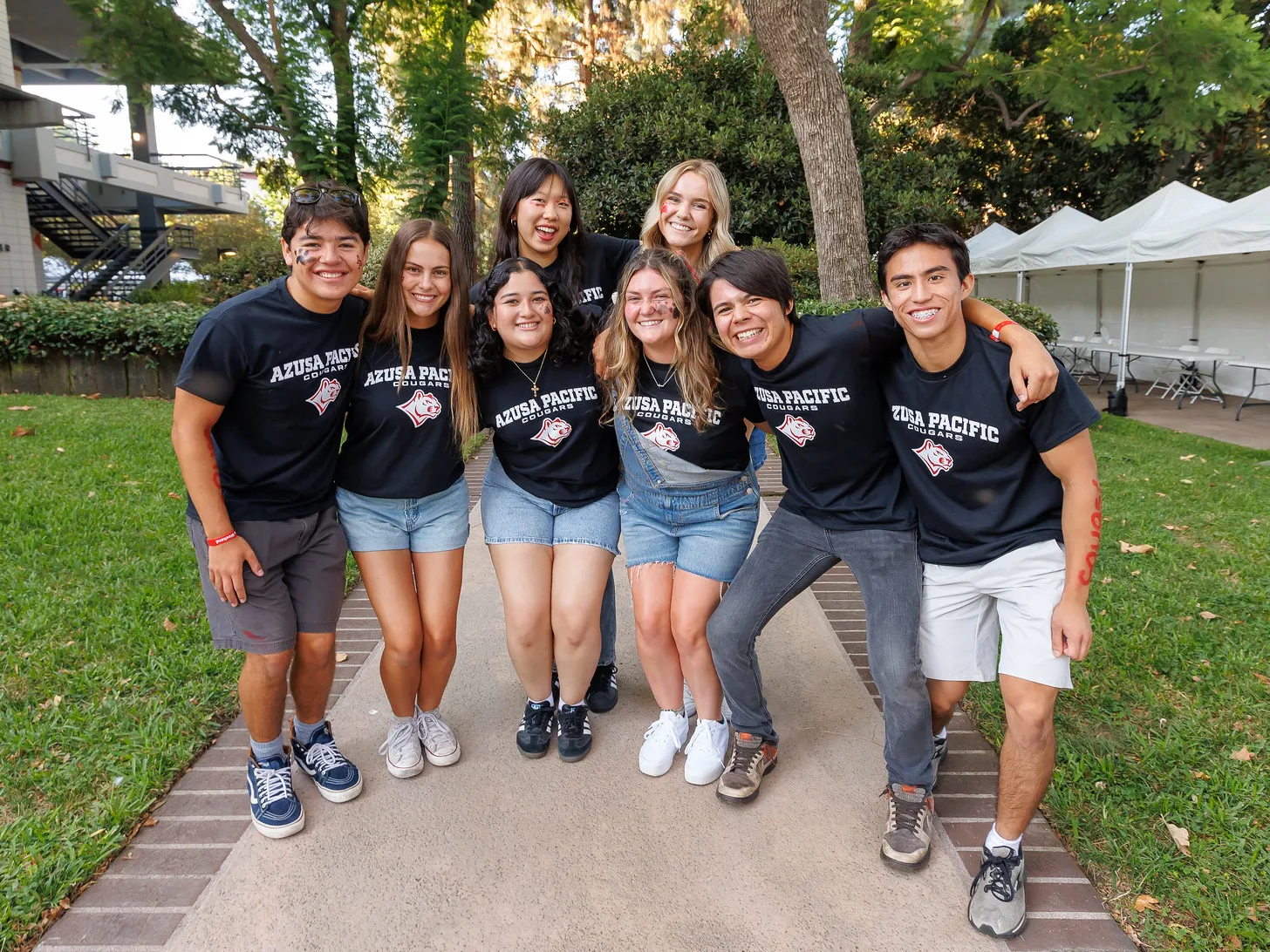 A group of APU students smiling