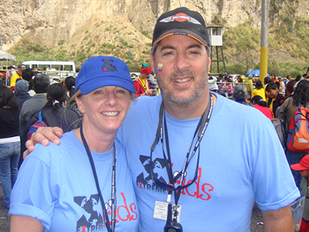 man and woman wearing blue t-shirt and smiling