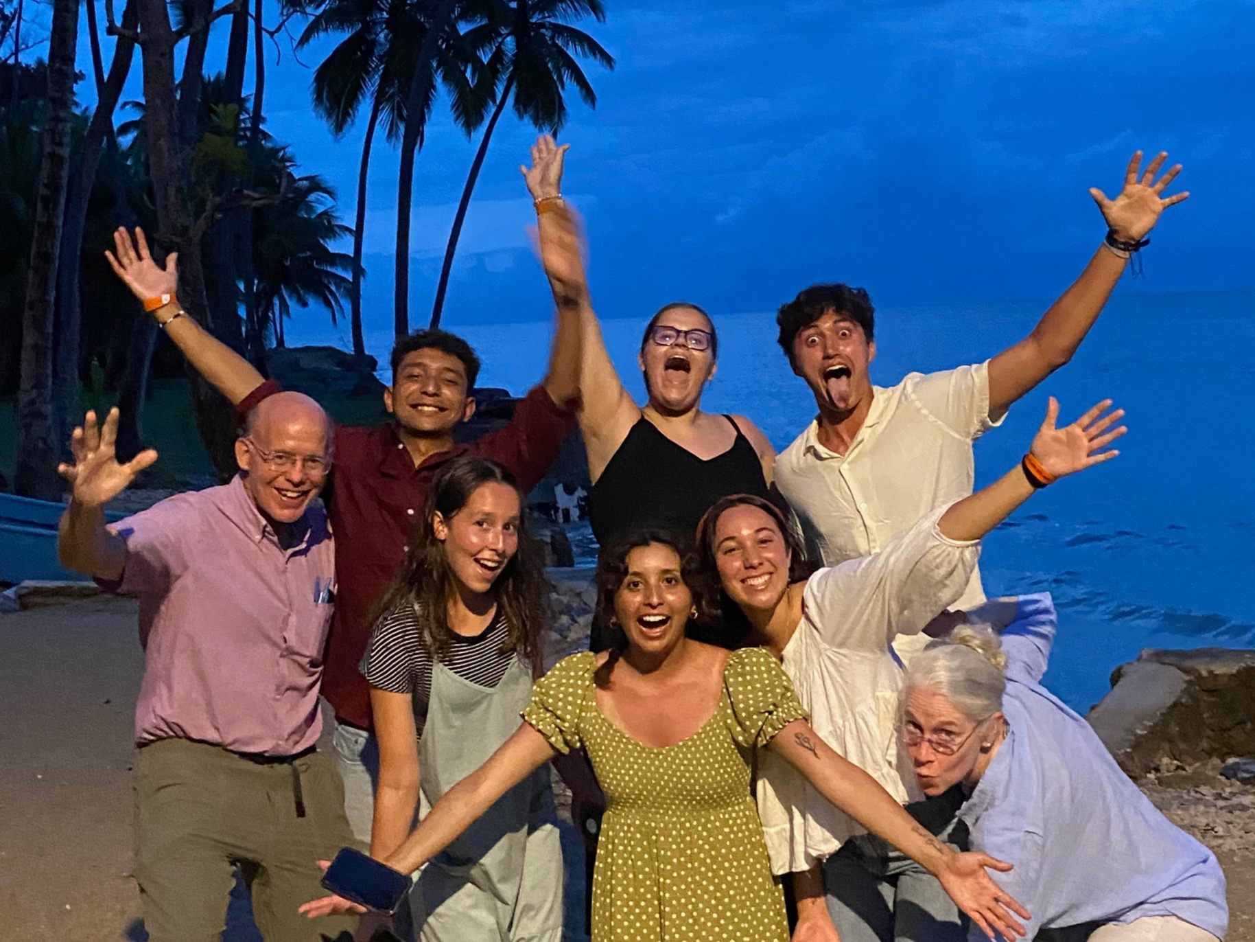 Olivia's team in the Dominican Republic waving at the beach