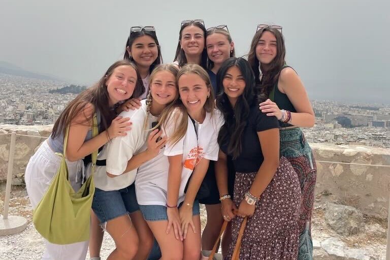 Adelaide and her global engagement team posing in Greece 