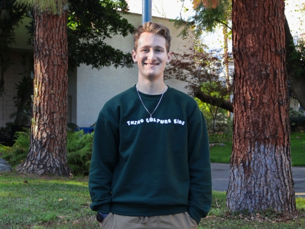 Jonathon Krohn wearing green and smiling