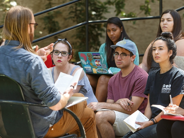 professor having a class outdoor with students