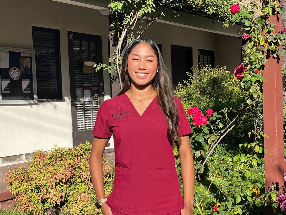 Jueliza smiles in APU’s Rose Garden