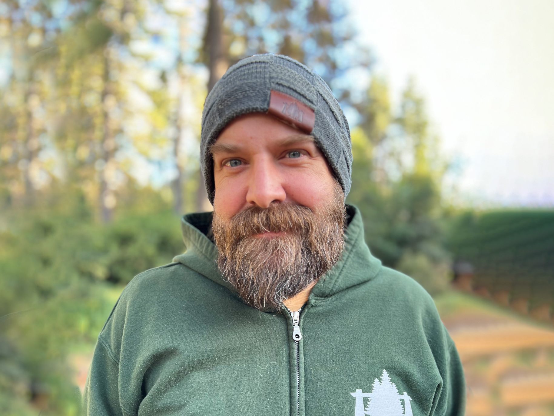 kelly smiles in the woods at Idyllwild pines camp