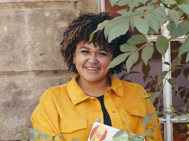 Micayla Brewster wearing yellow and smiling