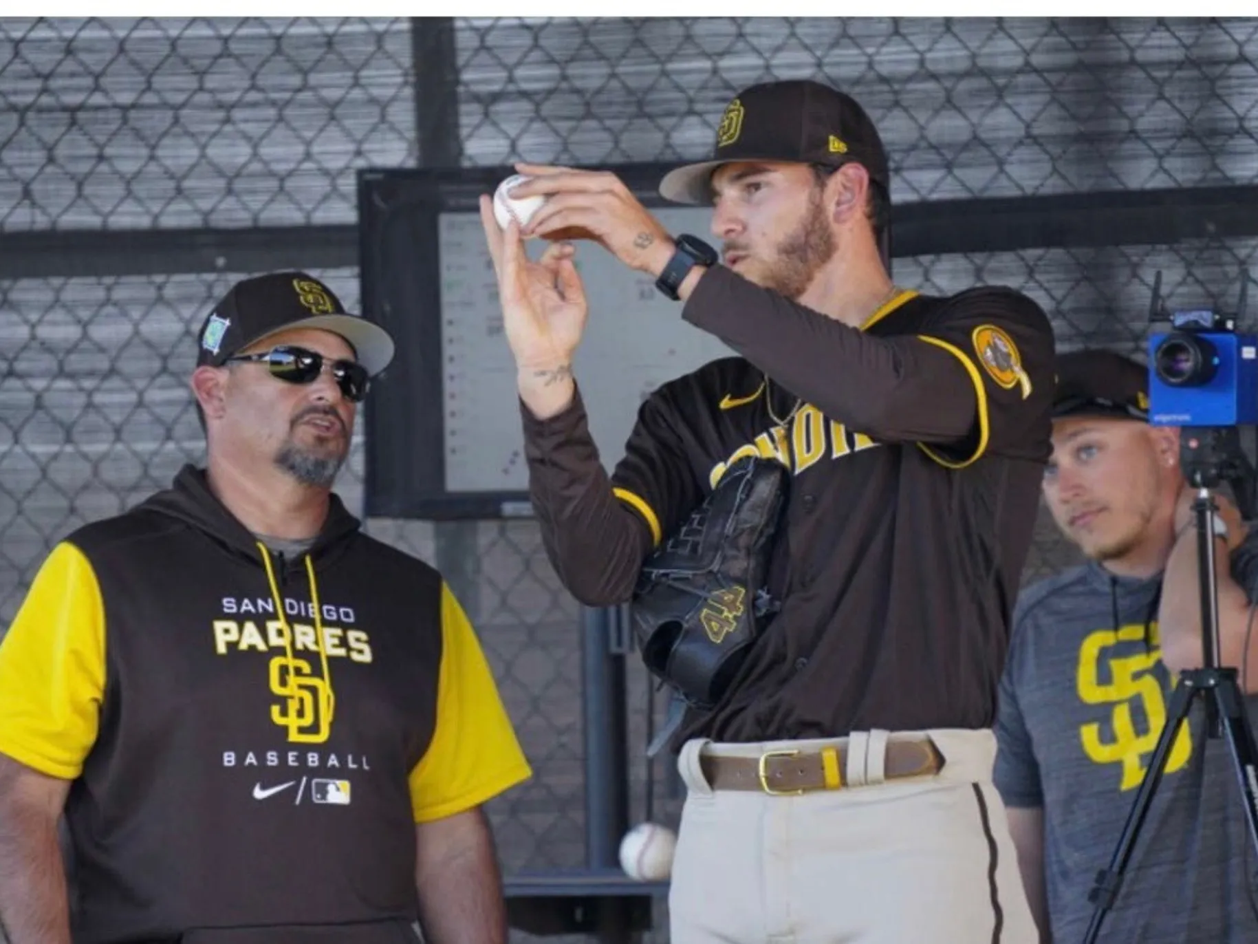 ruben niebla talking to a baseball player as he is holding the baseball