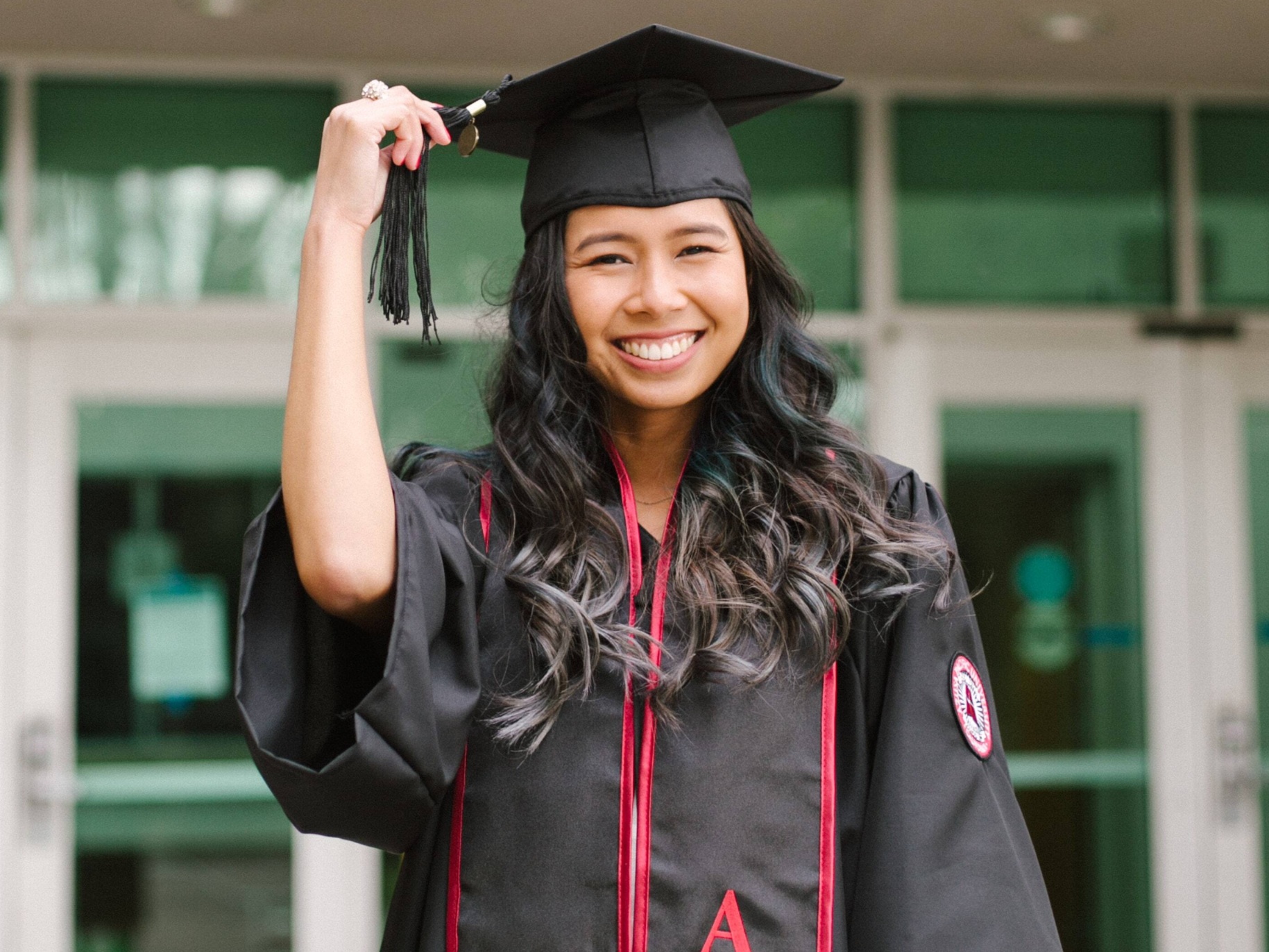 razel smiling in her cap and gown