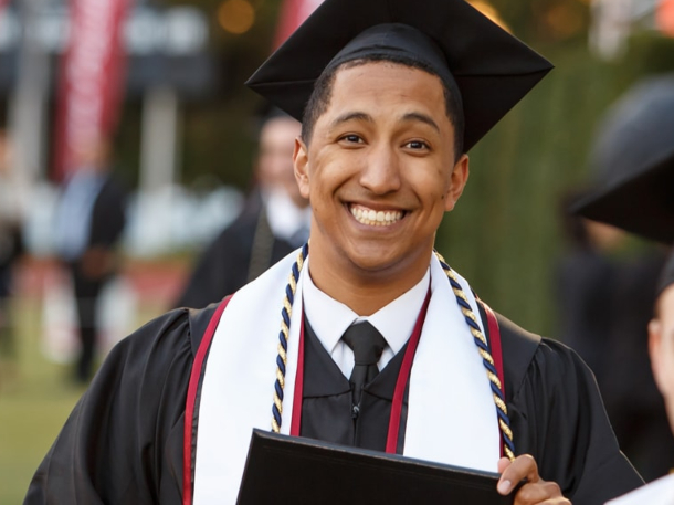 student smiling during commencement