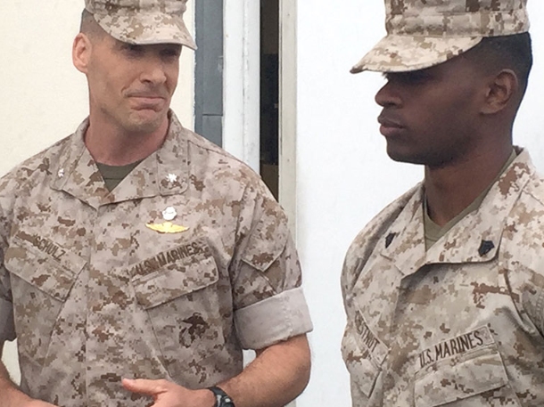 two U.S Marines wearing their army gear.