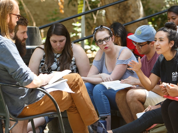 professor having a class outdoor with students