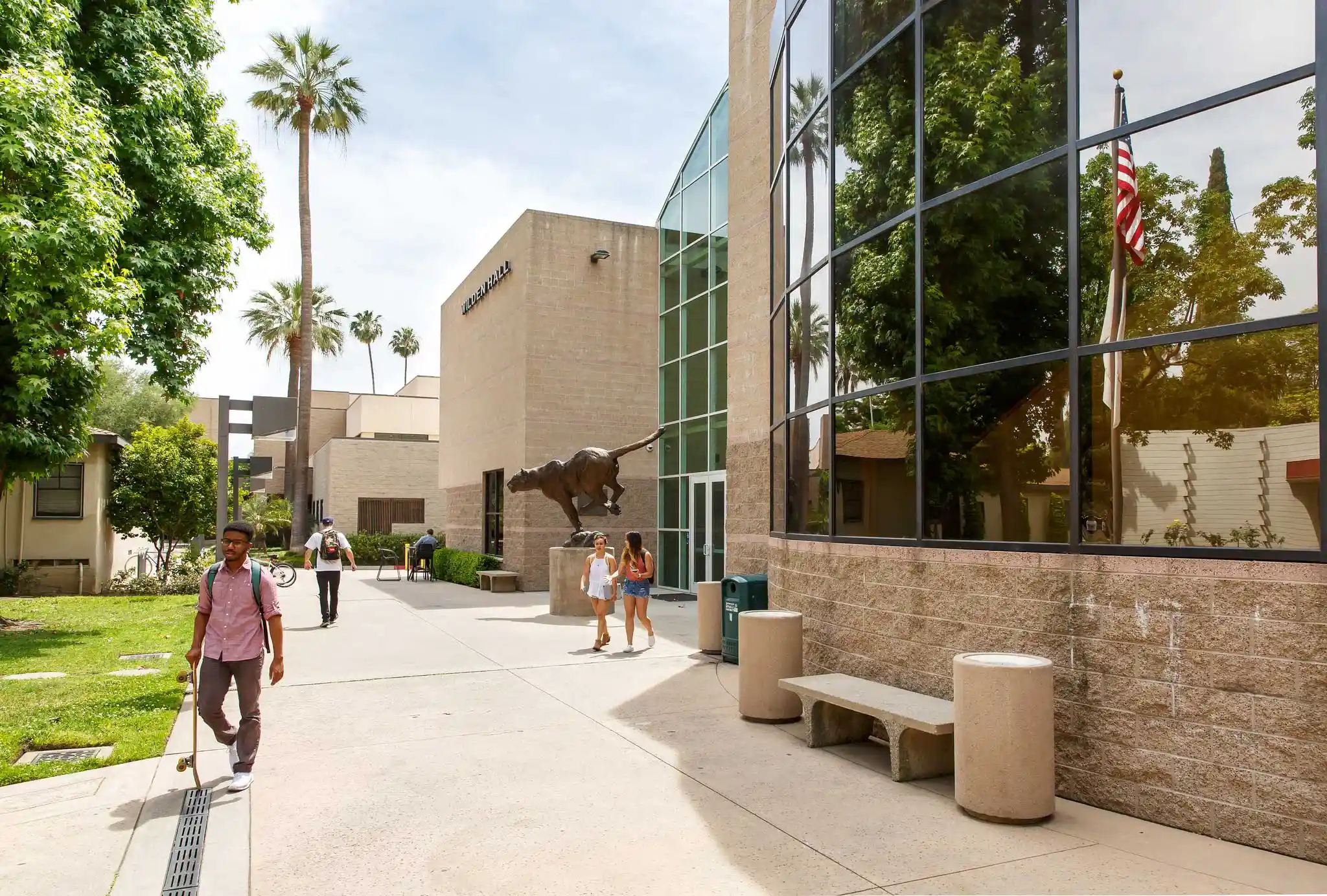 students walking outside of a building on east campus