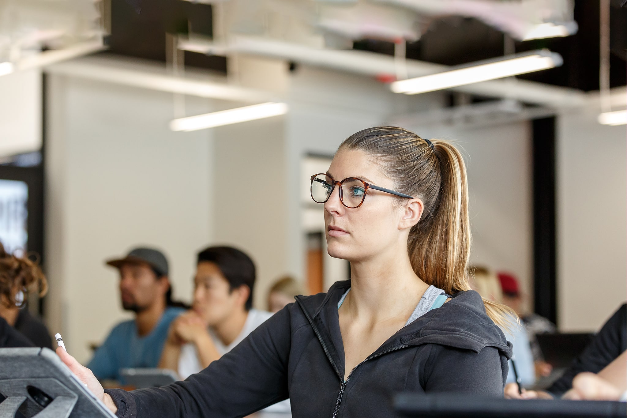 Female student with glasses in class