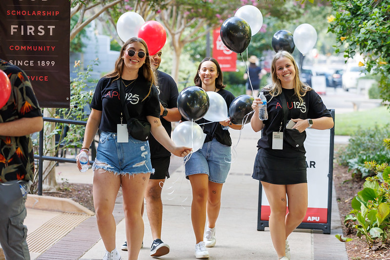 students smiling on campus life event