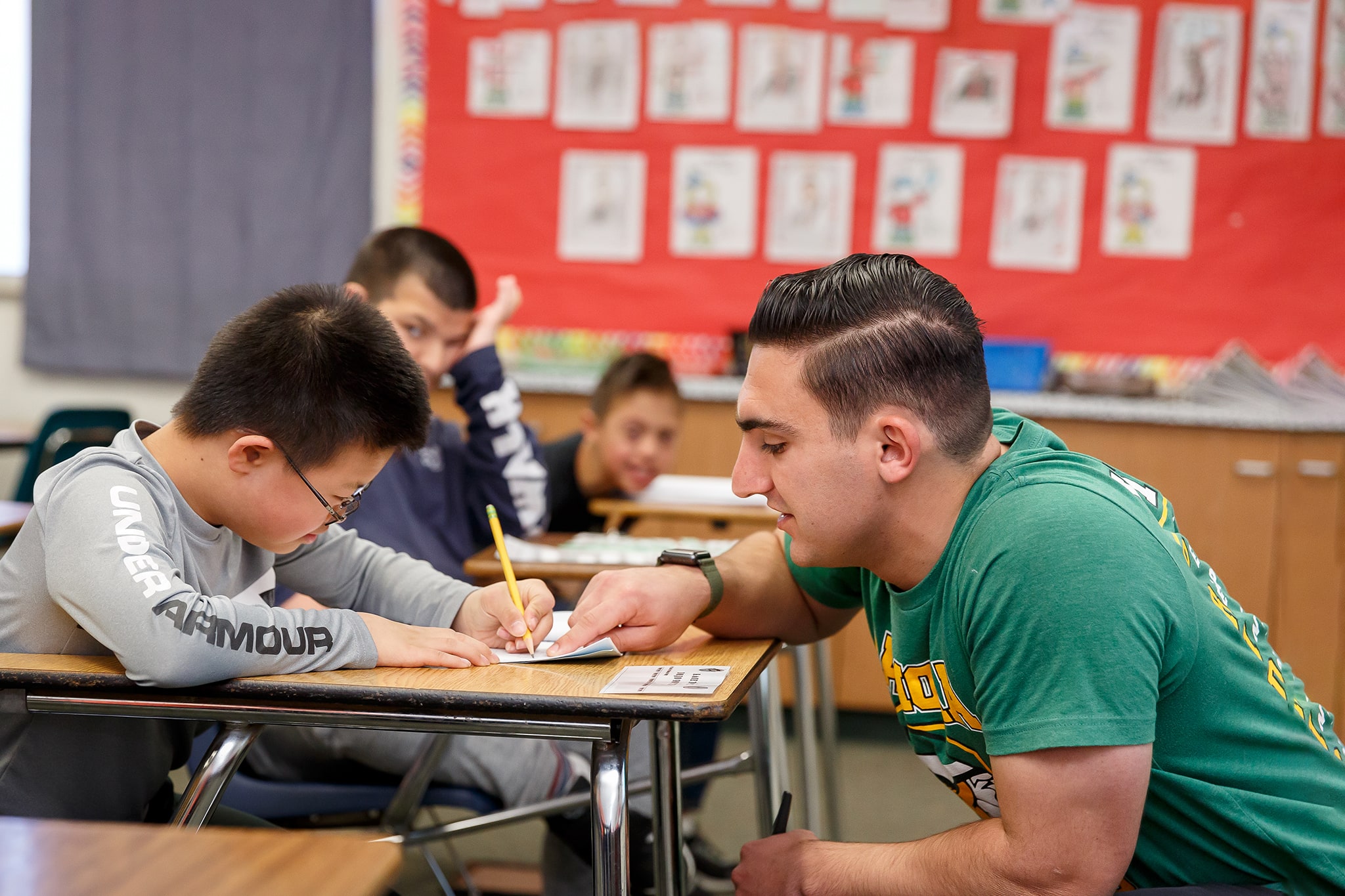 professor speaking to student in class