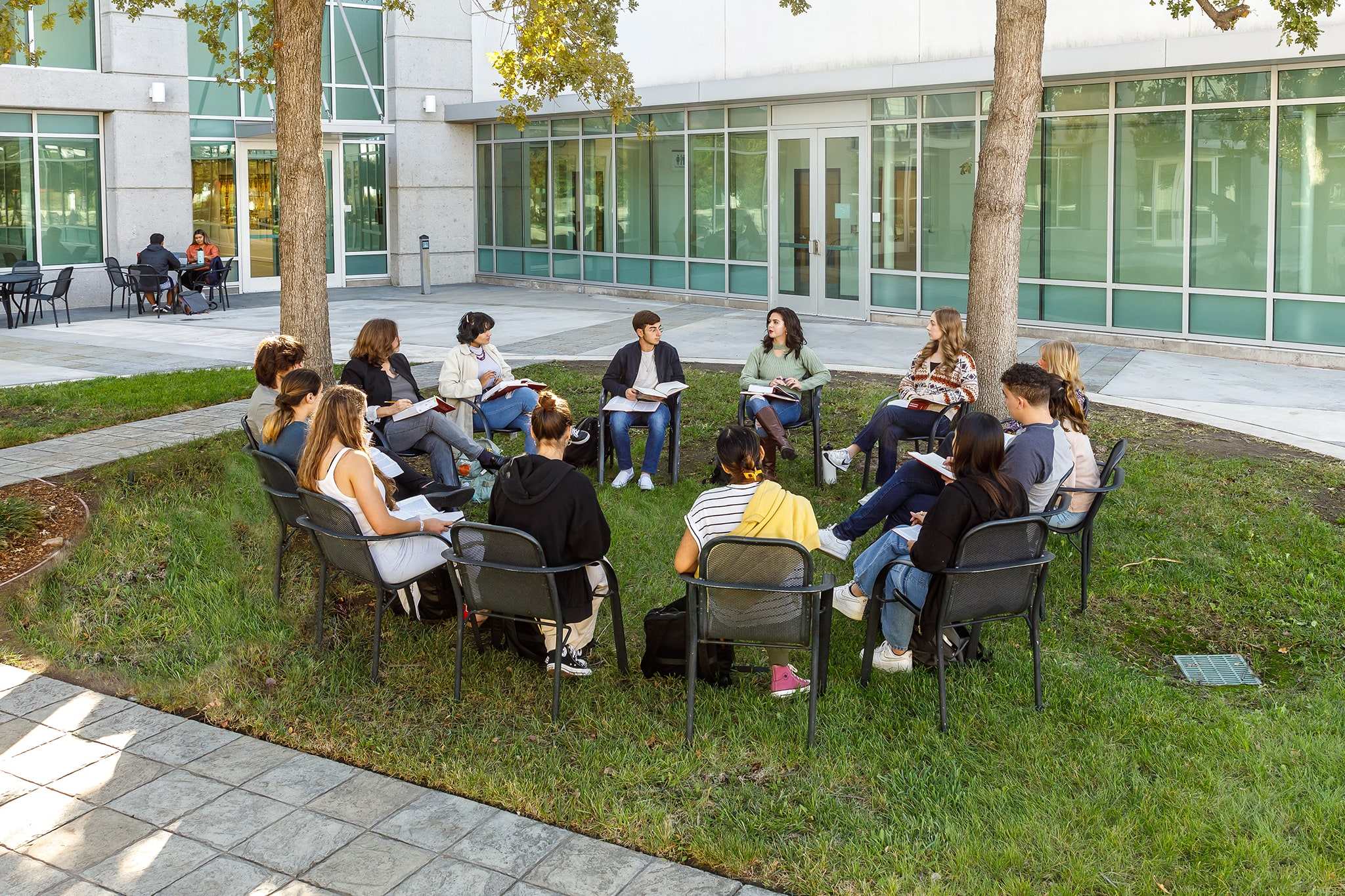 professor talking to students outside