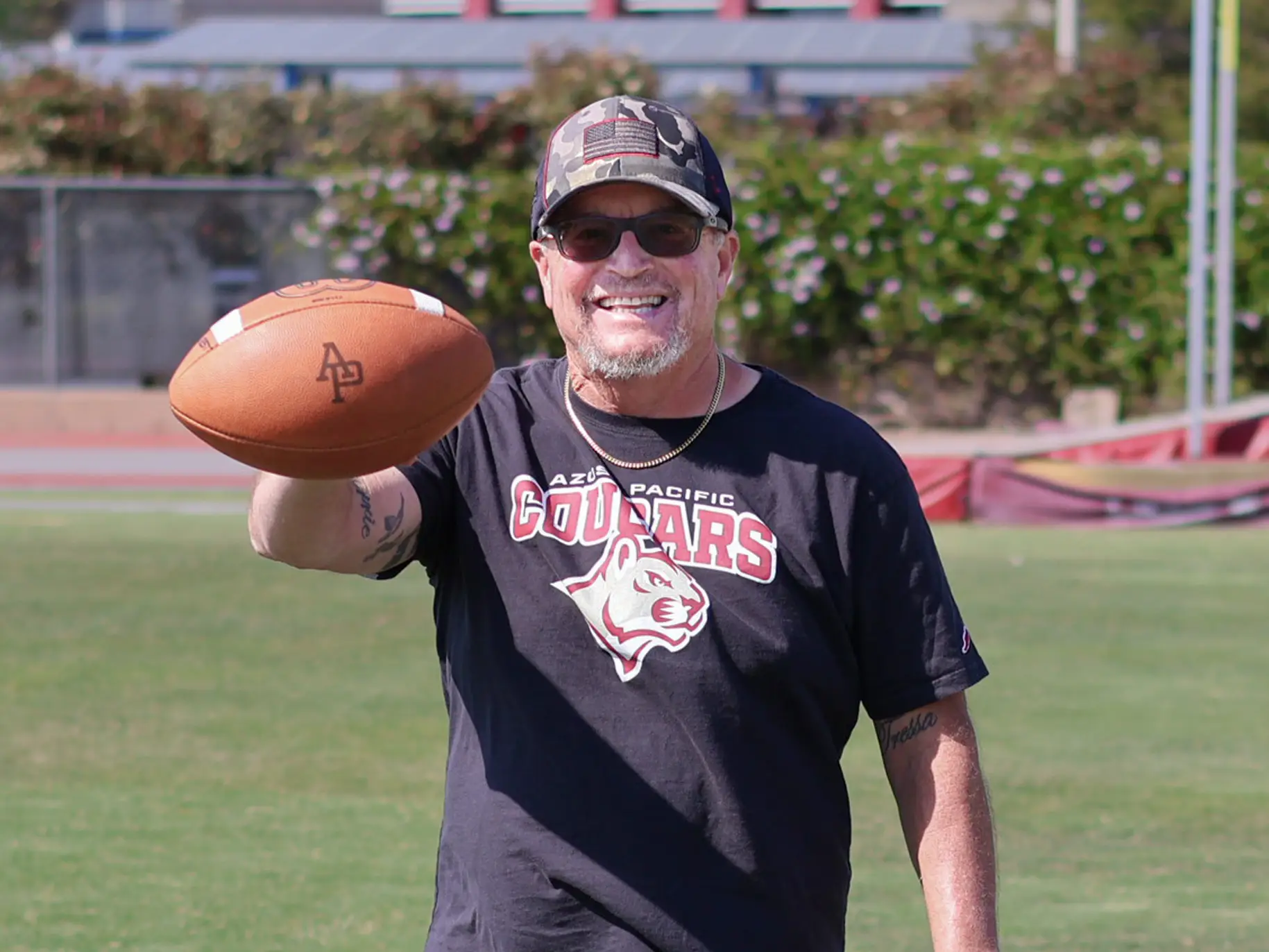 Bo Beatty poses with a football.
