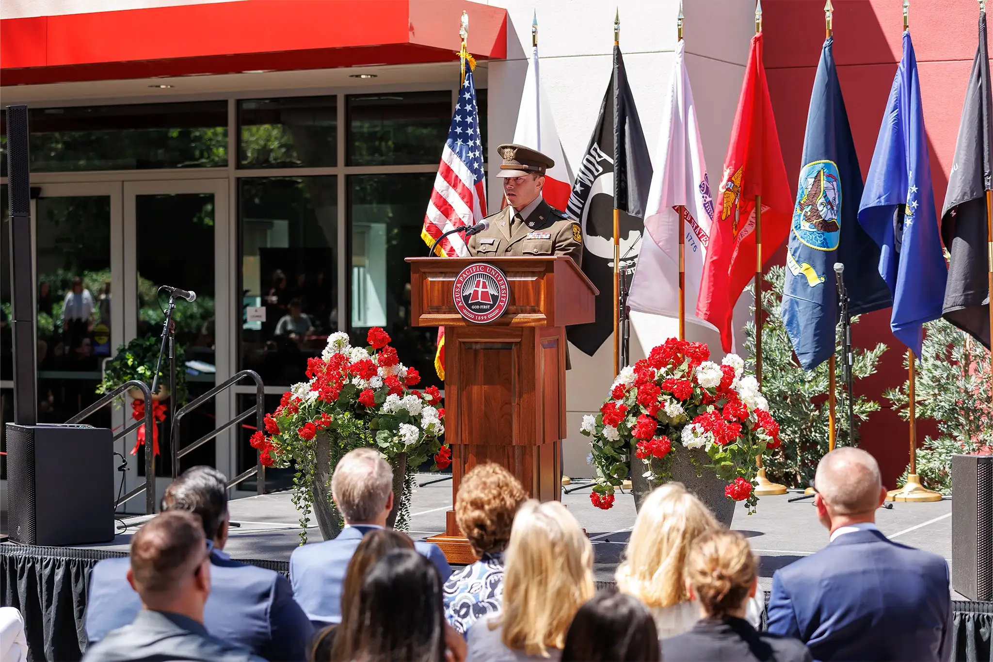 Military student behind podium