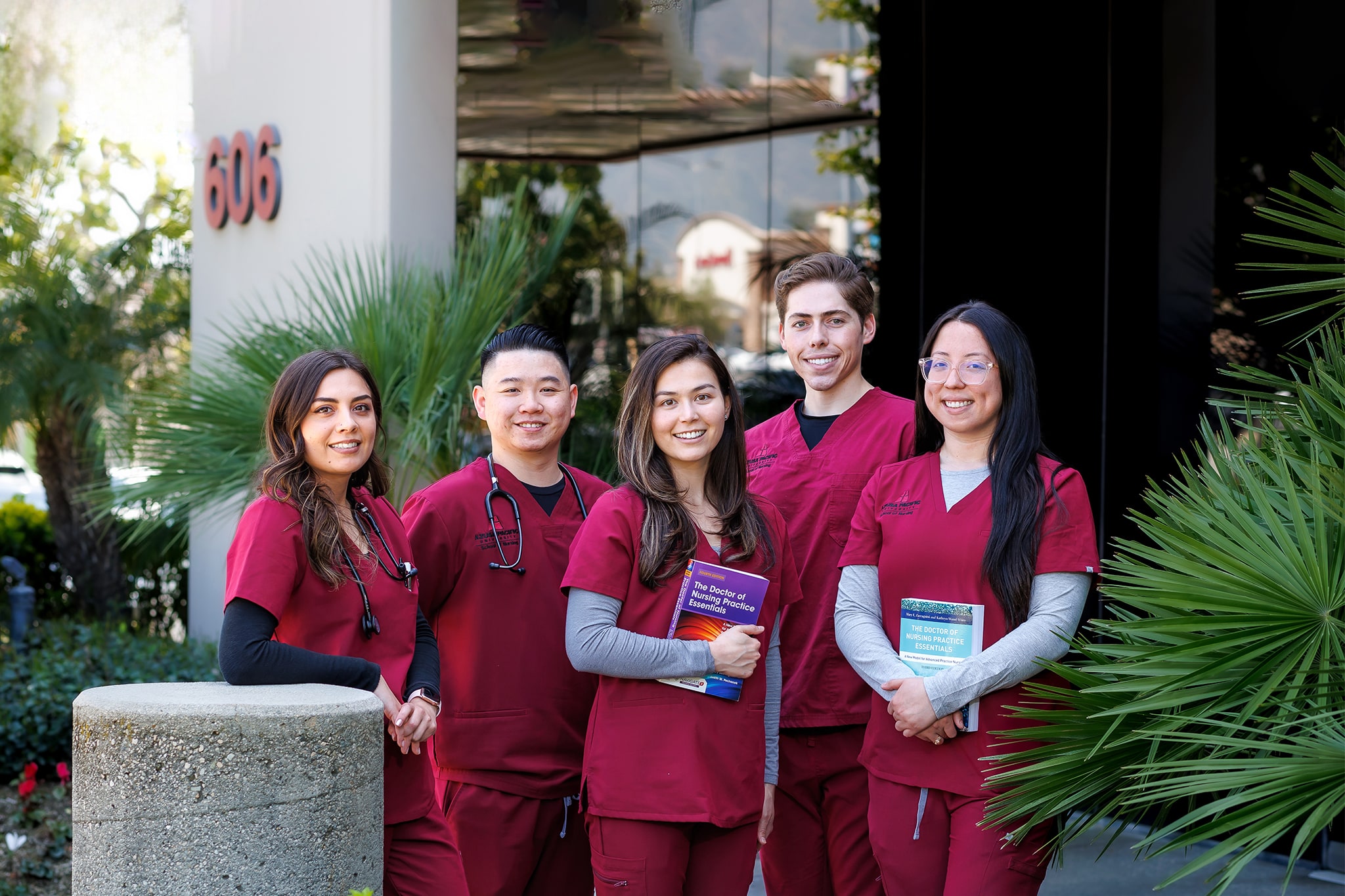 5 nursing students looking at the camera smiling