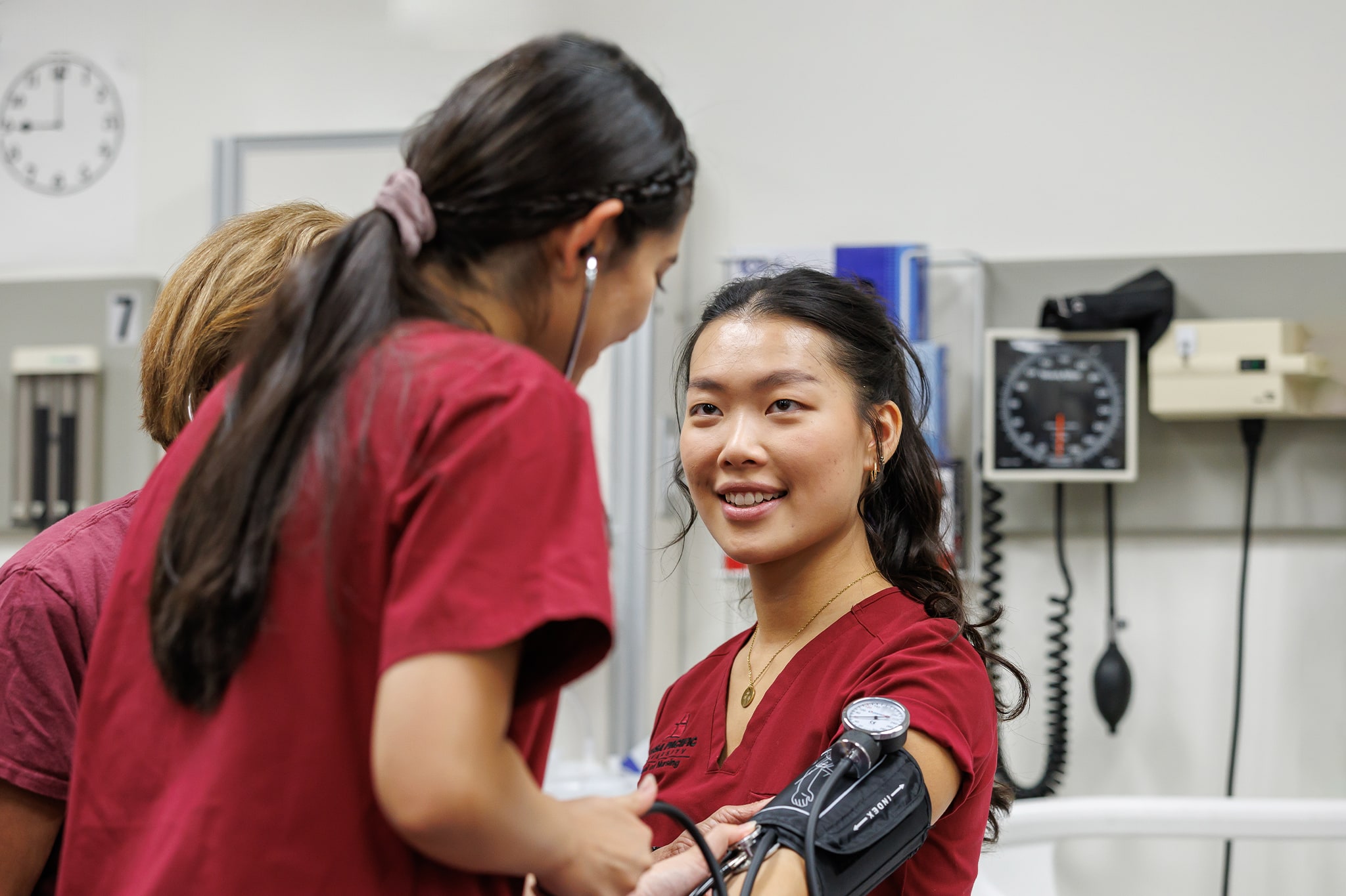 Student taking blood pressure