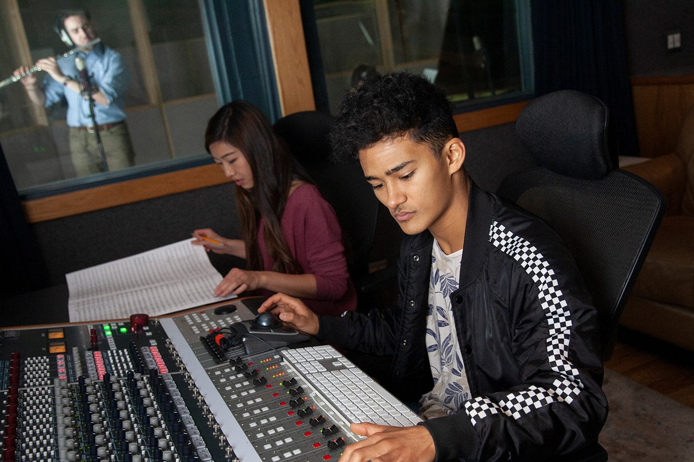 students learning how to use music equipments