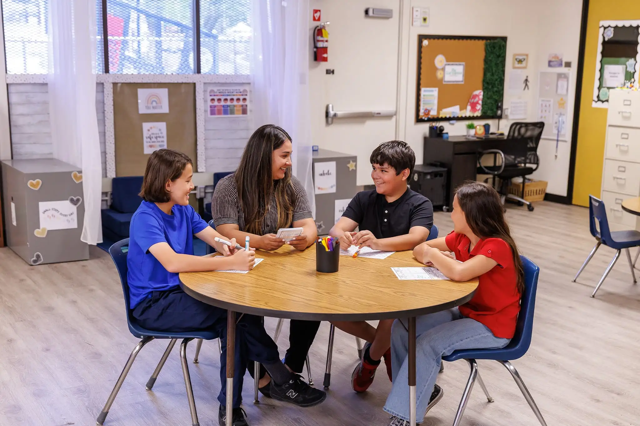 A group of students gathered together on a table
