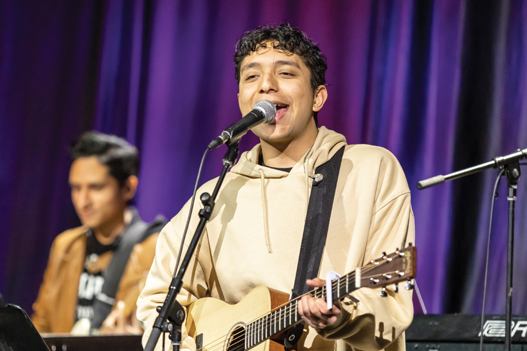 Student leading worship