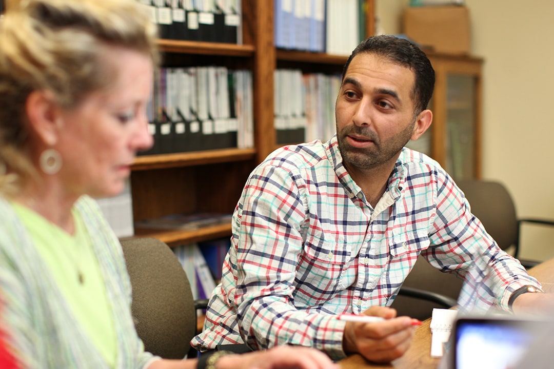 Student and teacher discussing