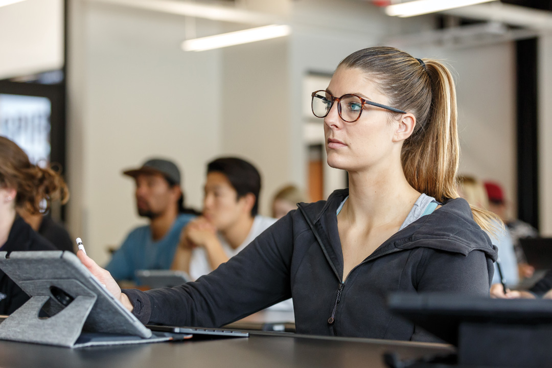 Student taking notes in class